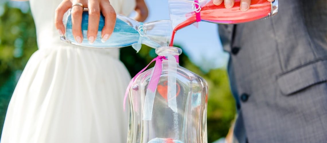 Newlyweds during sand ceremony